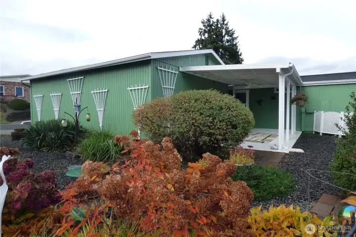 Side yard (next to the neighbors). The home is on a corner lot and right across from the clubhouse.