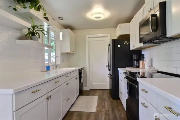 Remodeled kitchen with new cabinets  quartz counters