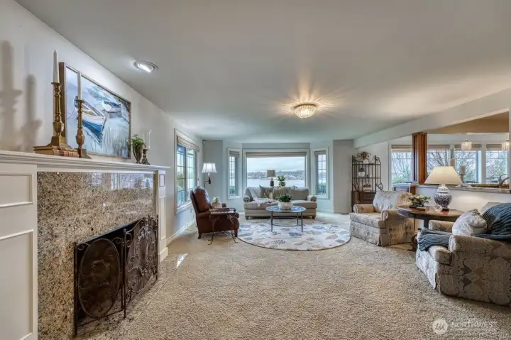 Entering the home, you are greeted this spacious living room. The wood burning fireplace is a great focal point. Nothing better than a crackling fire on those stormy days.