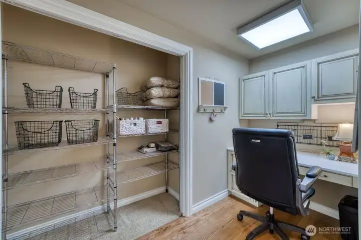 The main floor office with plenty of storage and built in cabinets.
