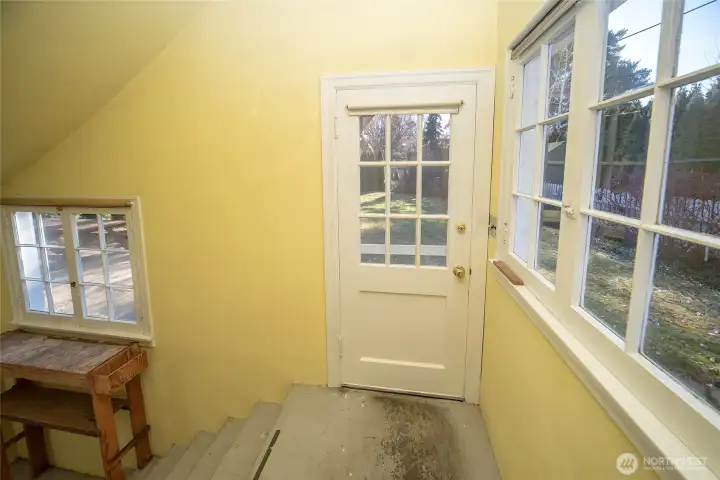 Backdoor to outside and access to basement.