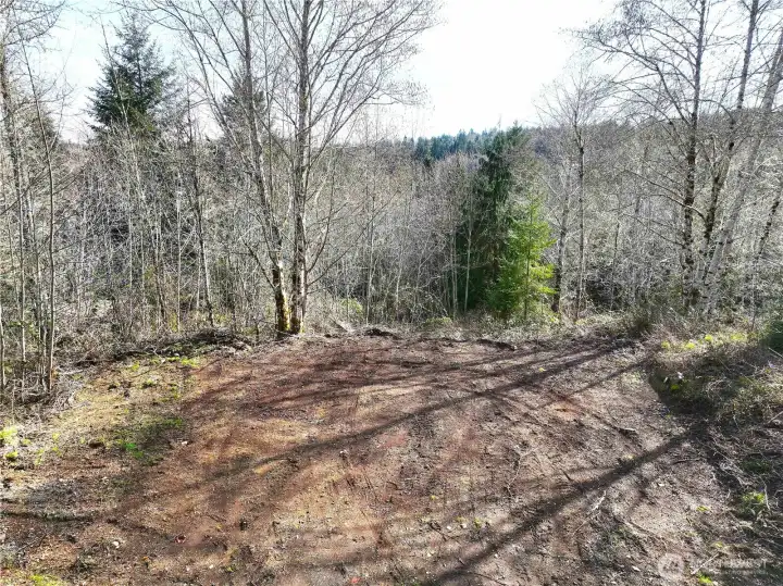 Upper cleared building site. Well located at top. 40gpm.