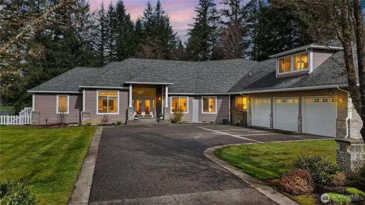 Ample parking in the garage, driveway, and around the side with separate RV space