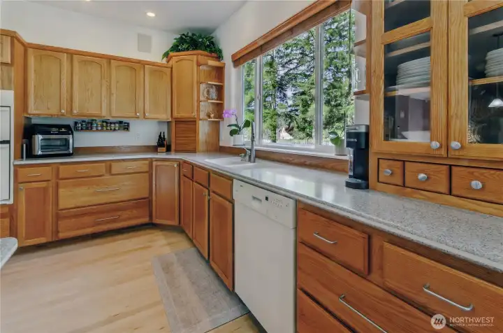 Lots of windows to enjoy the green belt behind the home