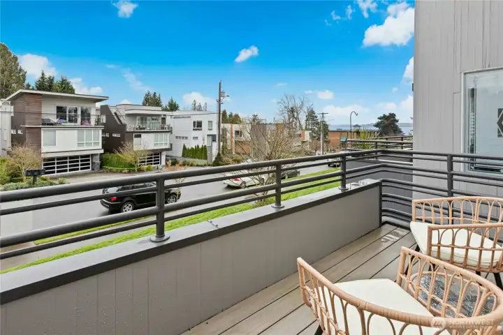 The balcony features composite decking and lake views.