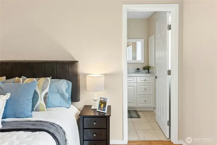 The second bedroom upstairs has it's own full bath with tile floors and new vanity.