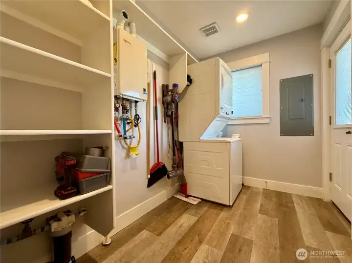 Mud/utility room with door leading to the side driveway.