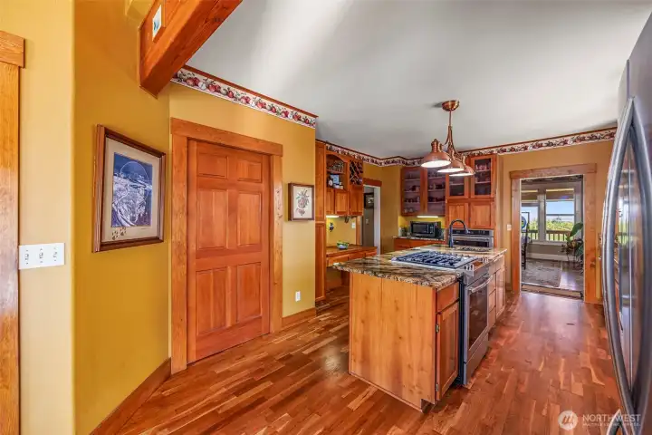This walk-in pantry offers plenty of storage space, including an extra refrigerator—perfect for keeping your kitchen organized and well-stocked. A practical and spacious addition to this recently updated kitchen!