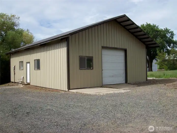 This spacious 30x45 foot shop comes equipped with a wood stove to keep you warm while working. Featuring a large garage door, it's perfect for bringing in equipment for projects or repairs. Additionally, there's an extra office area for your workspace needs....
