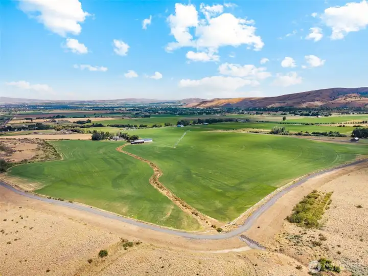 Southeast-facing view highlighting the irrigated fields, with recent improvements by the KRD including upgraded concrete piping designed to enhance water efficiency and conservation. A valuable infrastructure upgrade that supports long-term agricultural productivity and sustainability.