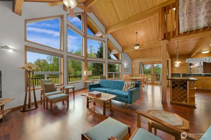 Great room floor plan is open and bright, with Brazilian Cherry floors and soaring vaulted ceiling.