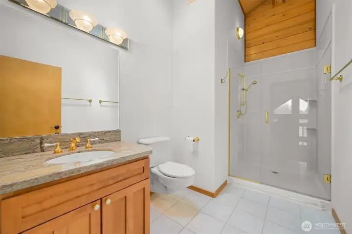 Upstairs bathroom has a walk-in shower.
