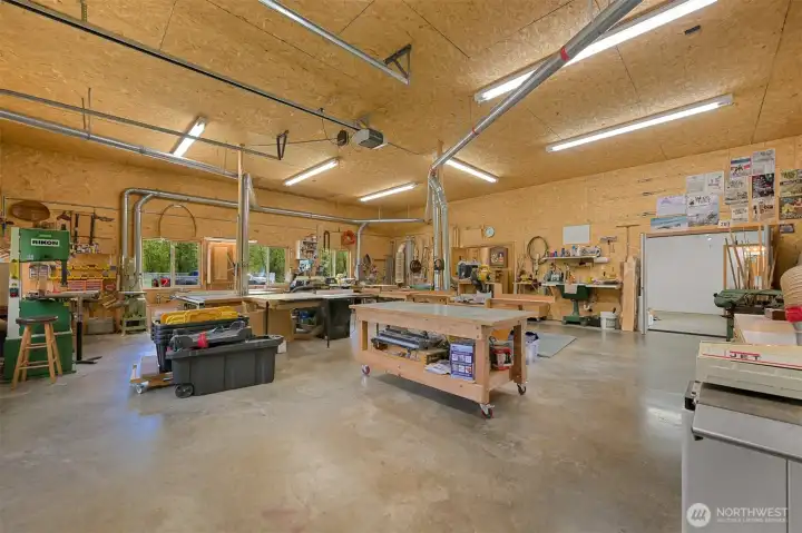 Massive workspace with heating and cooling, a cast iron sink, plenty of 220 outlets and a dedicated welding circuit