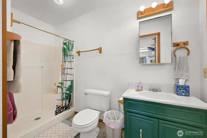 Bathroom adjacent to office.