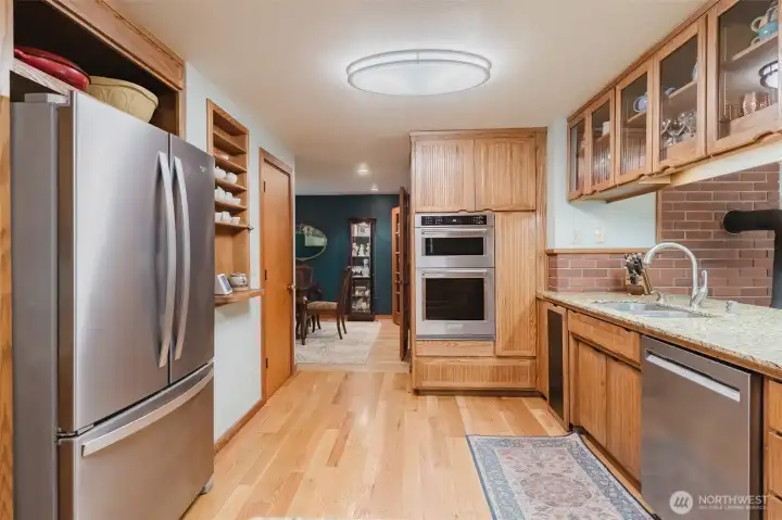 Stainless steel appliances and slab granite countertops.