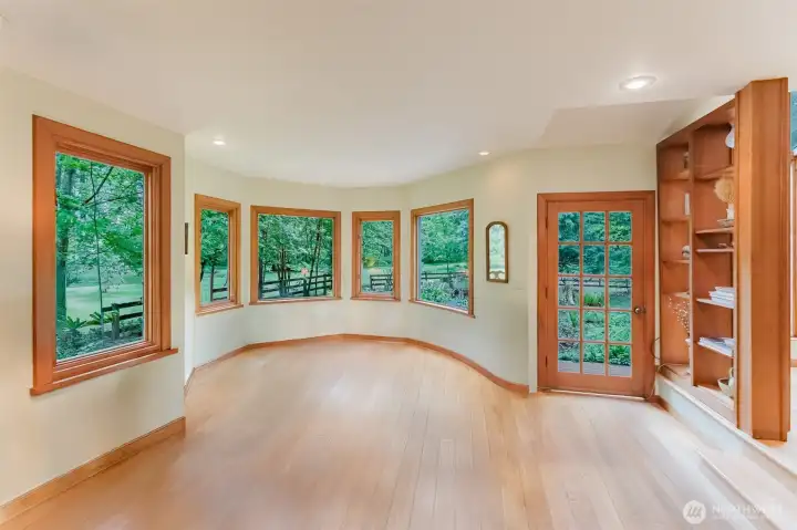 The wood framed windows maximize the views of the beautiful grounds.