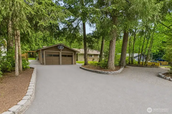 Situated on a park-like lot with mature trees. And plenty of room for parking!