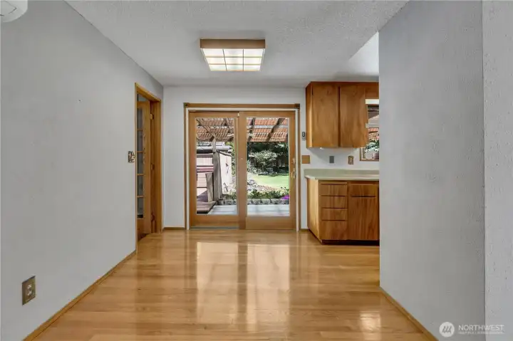 Gleaming hardwood floors in the dining room and kitchen