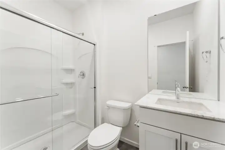 3/4 bath on Main floor DISCLAIMER: Photos are for informational purposes only and are of another Sapphire floor plan in the community; actual colors, flooring, or carpet may vary 3/4 bath on Main floor DISCLAIMER: Photos are for informational purposes only and are of another Sapphire floor plan in the community; actual colors, flooring, or carpet may vary