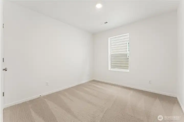 Bedroom #2. DISCLAIMER: Photos are for informational purposes only and are of another Sapphire floor plan in the community; actual colors, flooring, features or carpet may vary Bedroom #2. DISCLAIMER: Photos are for informational purposes only and are of another Sapphire floor plan in the community; actual colors, flooring, features or carpet may vary
