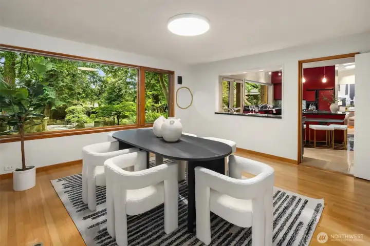 The dining room is conveniently located next to the kitchen.