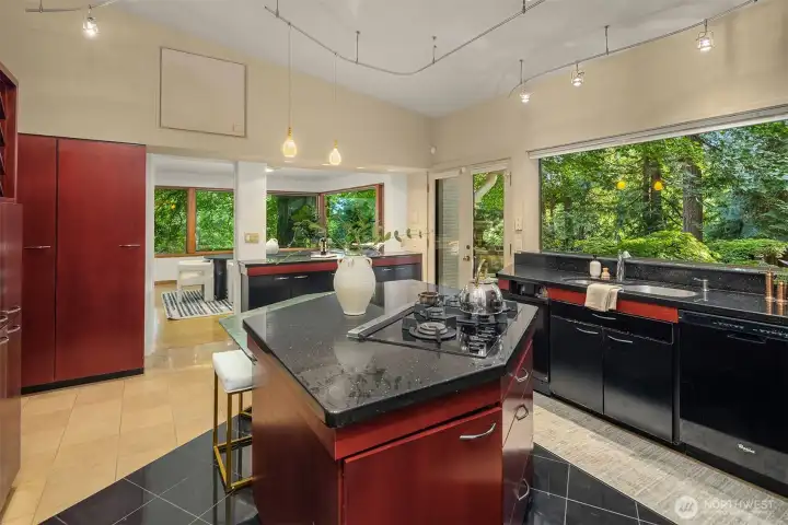 High ceilings for the kitchen which flows into a cozy sitting area.