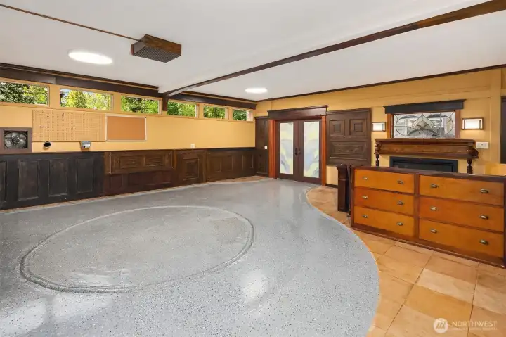 This room offers a uniquely versatile space. The current owner used this space for ceramics and pottery. The ceiling shower head was installed to soften the impact of the dust and a circular "pool" was created to collect the water.