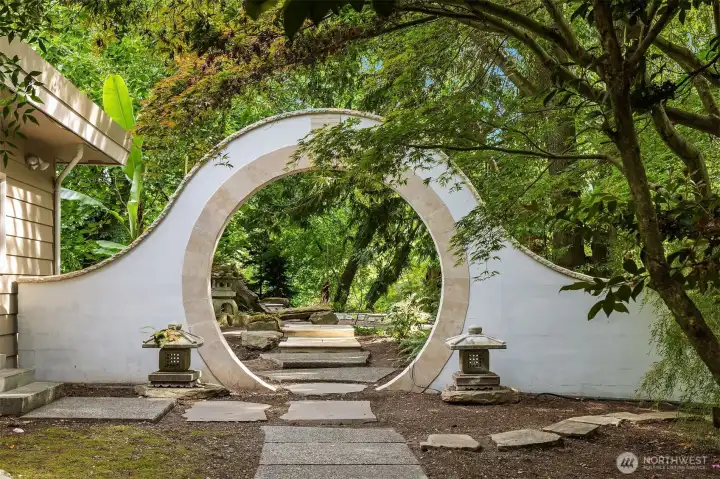 Custom "Moon Gate" inviting guests into the garden