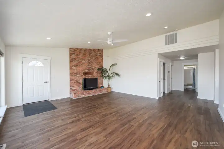 Living room with wood burning fireplace. Living room with wood burning fireplace.