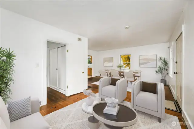 Another view of the living room showing separation of living and dining area.