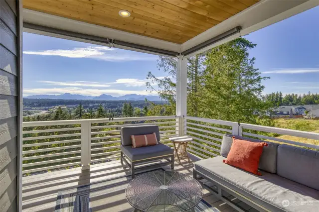 Covered deck off the kitchen.  Views of the Olympics and Sunsets!