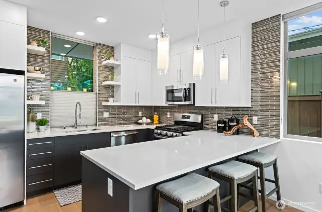 Nice finishes with tile backsplash to the ceiling.