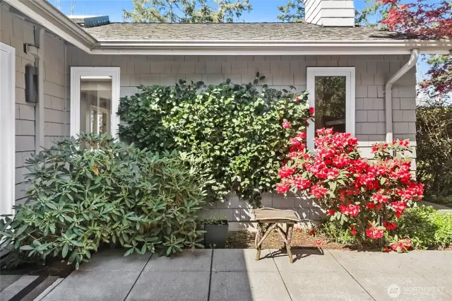French doors seamlessly connect the kitchen to a private courtyard, offering the perfect setting for al fresco entertaining.