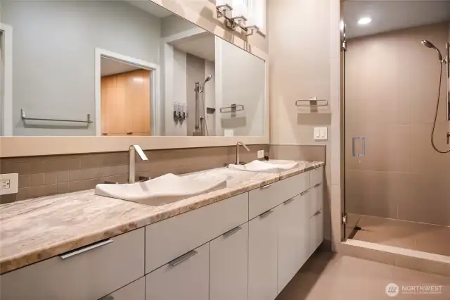 The Primary Bathroom offers a perfect blend of luxury and comfort, offering ample space to unwind in a serene, spa-like atmosphere.