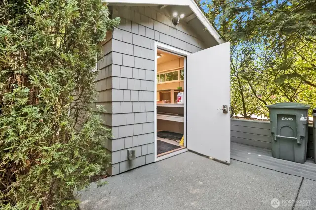 A spacious shed provides convenient extra storage, perfect for tools, outdoor equipment, or seasonal items.