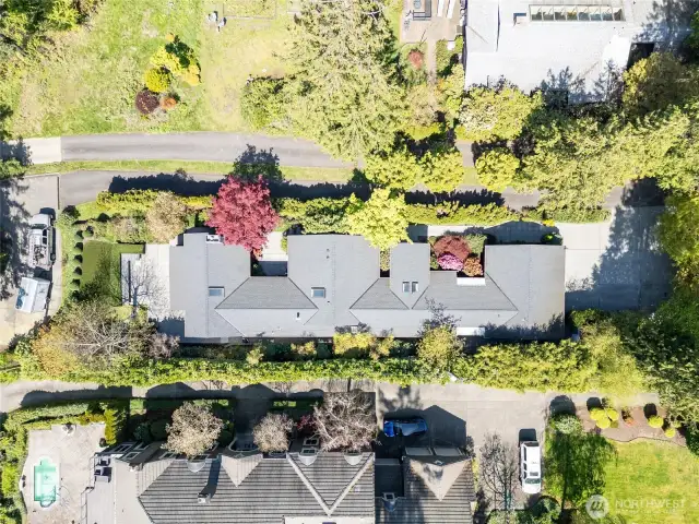 A breathtaking aerial perspective showcases the grandeur of the home and its expansive grounds, offering a stunning look at the meticulously landscaped surroundings and tranquil setting.