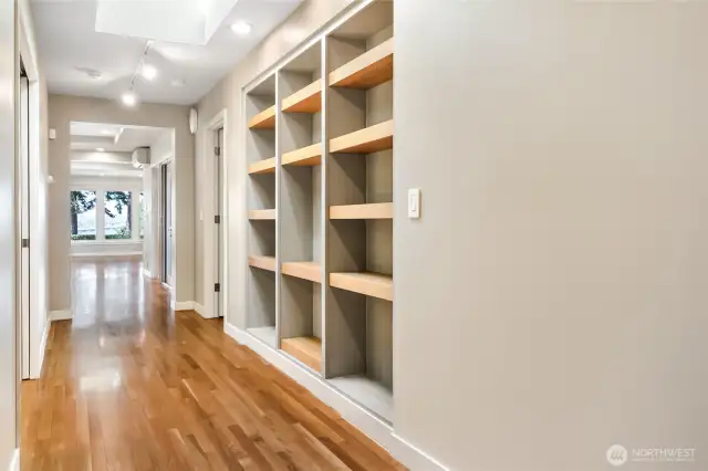 Thoughtfully designed with smart, built-in shelving crafted from natural wood