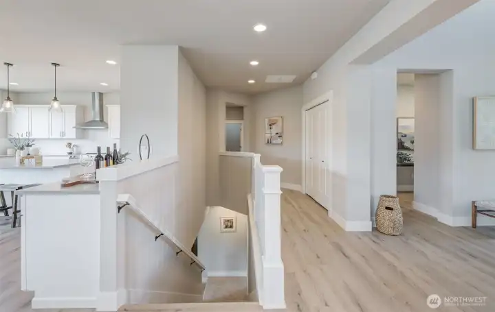 Either down to the lower floor, or open hall to Primary