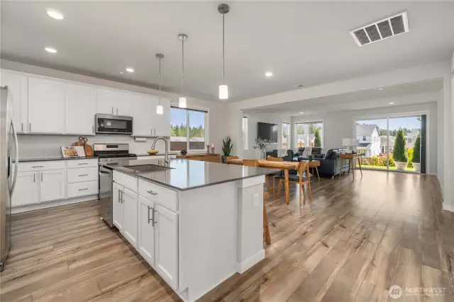 The open layout features 9’ ceilings and durable LVP flooring
