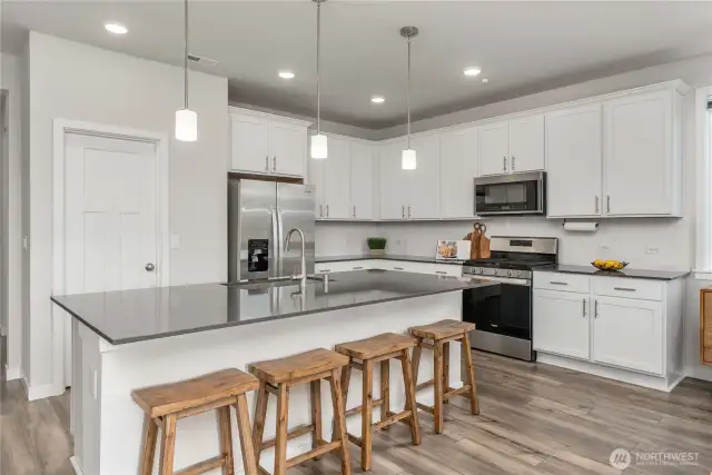 Sparkling quartz countertops, and an oversized chef's island