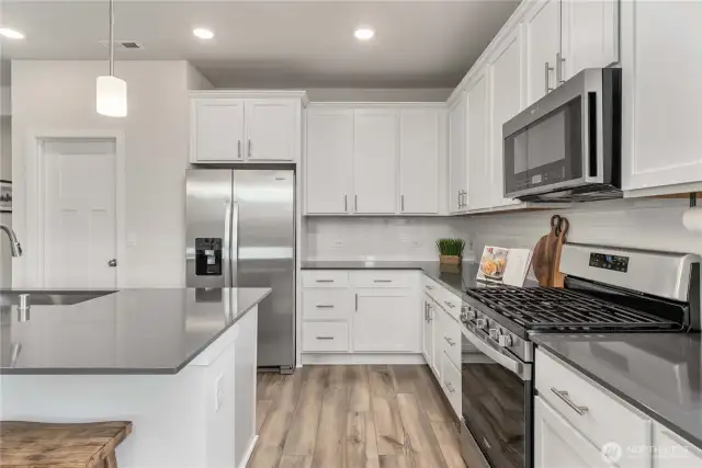 42" white maple cabinets with soft-close doors and crown molding