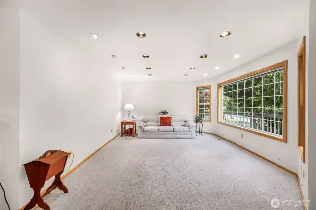 Large formal living room with lots of natural light