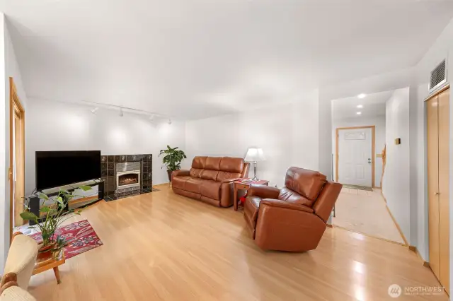 Second living room with gas fireplace and open concept to dining and kitchen