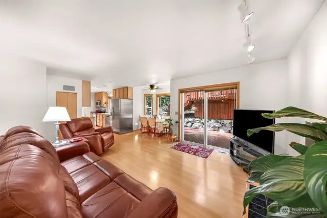 Living room has sliding doors to beautiful outdoor deck & entertainment space