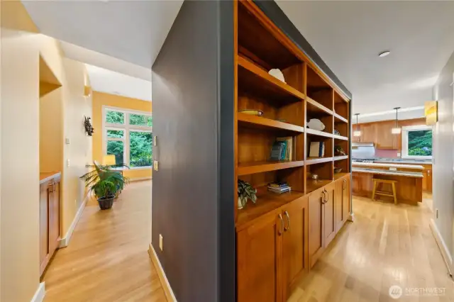 Solid wood built-ins, crafted from cherry and birch. This hallway shelf and cabinet library is stunning!