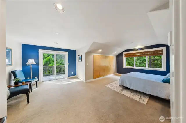 The loft level primary bedroom has an exterior door to a private deck, and stairs down to the yard.