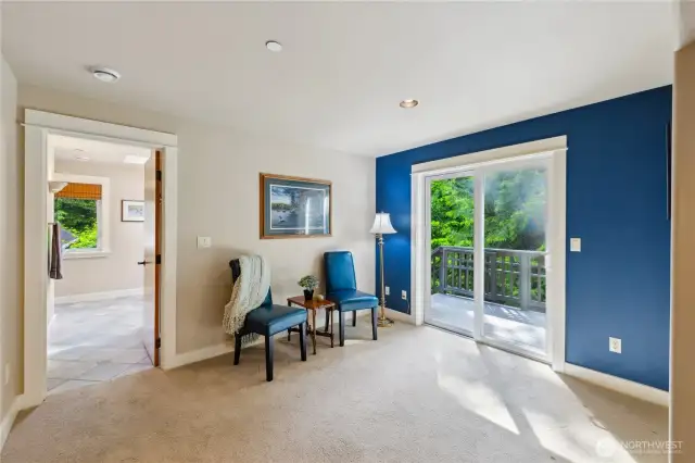 The loft level bedroom suite has room for a couch or sitting area, and there you see the door to the bathroom.