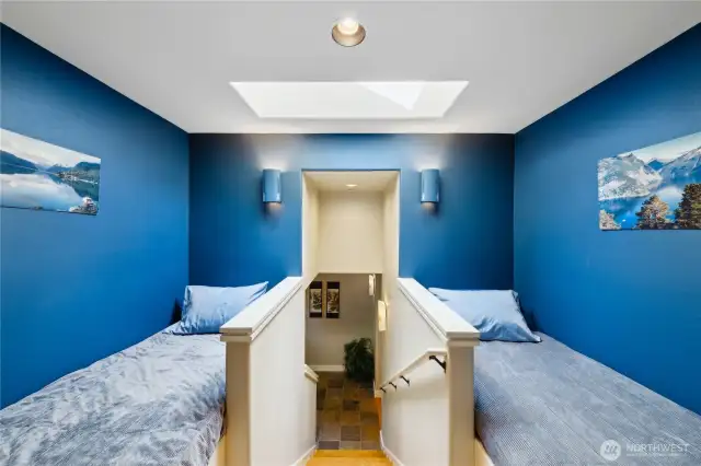 Flanking the entrance to the loft suite, are two guest berths - adorable. Secret storage under these bunks.