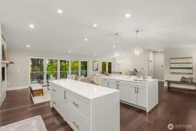 Double quartz waterfall islands with a second chefs sink and ample storage!