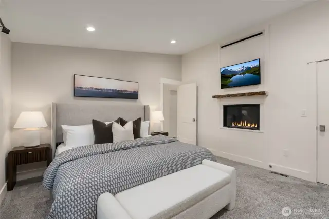 Primary suite on the main floor features a gas fireplace and blower.
